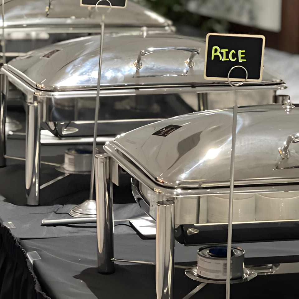 Pakwan Indian restaurant buffet with several silver chafing dishes, one labeled "RICE".
